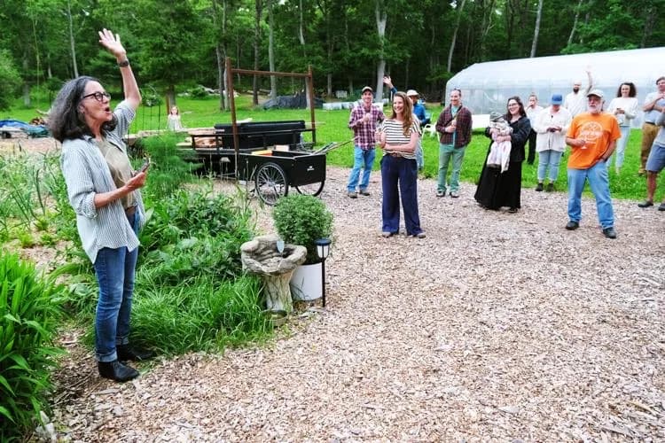 A Farming Falmouth host welcoming visitors at The Patch community farm in East Falmouth, Massachusetts.