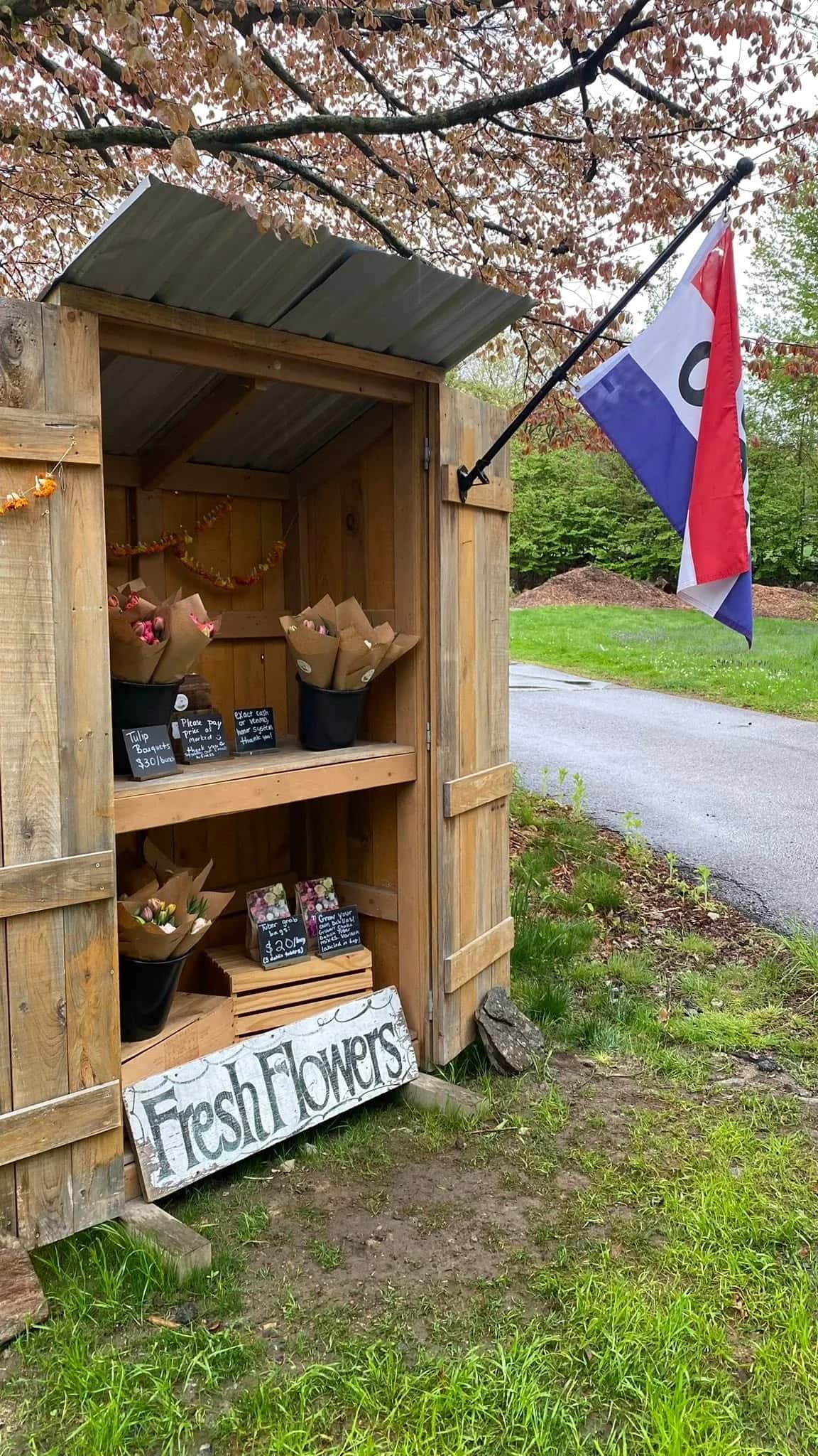 Roadside fresh flower stand at Wild Poppy Farm in Grafton, Massachusetts.