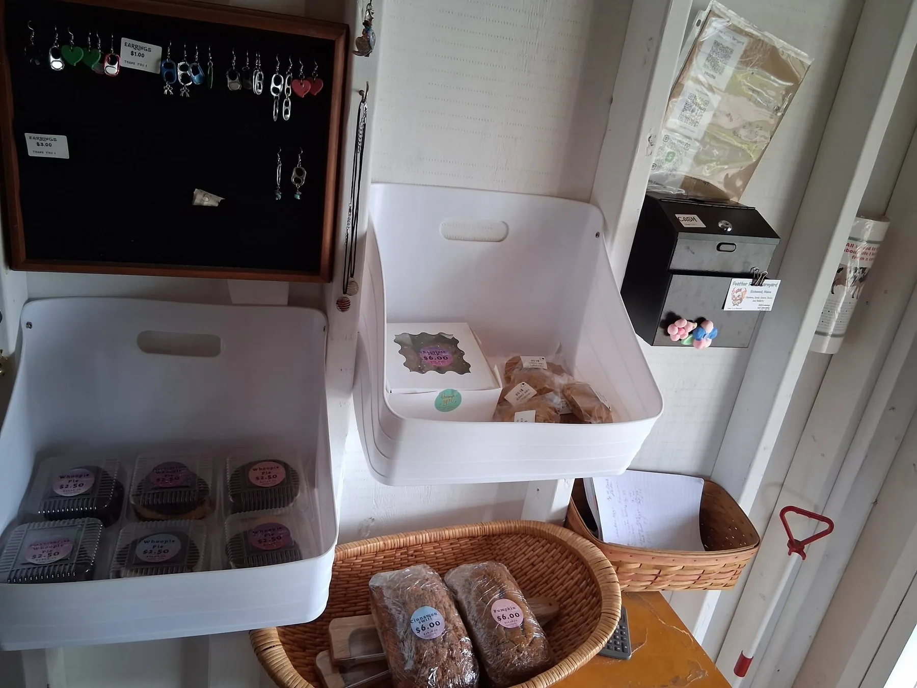 Baked goods, handmade items, and honor to system payment setup at Feather Foots Barn Yard in Richmond, Maine.