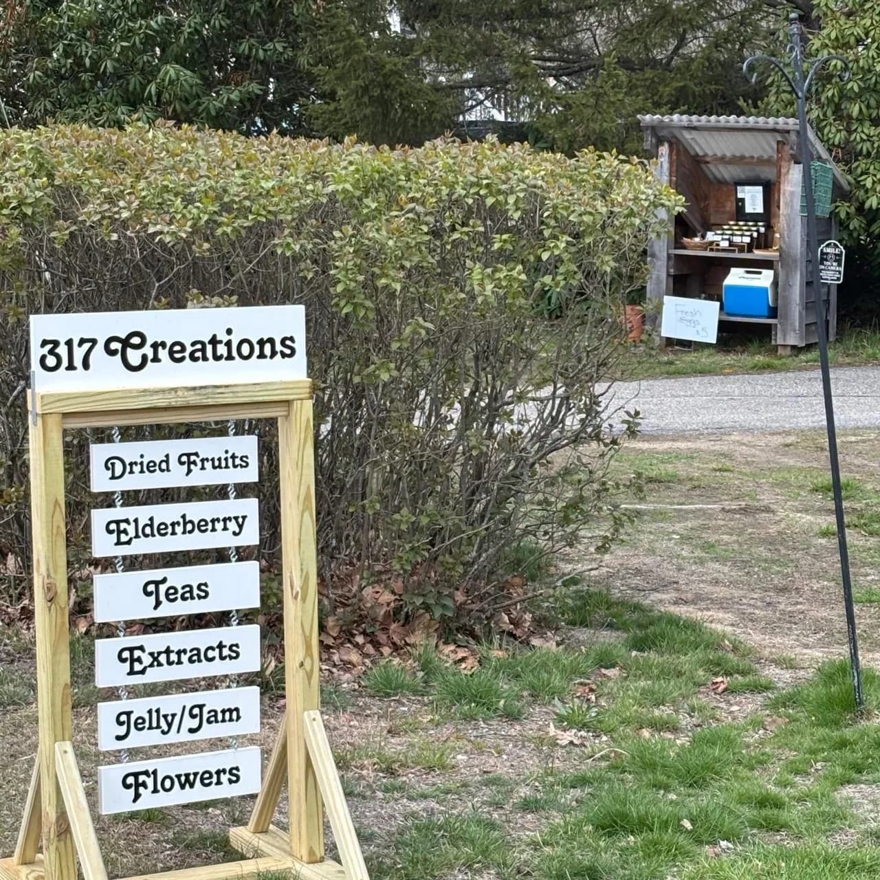 The 317 Creations self to service farm stand sign and roadside stand at 317 Mill Road in Hampton, New Hampshire.