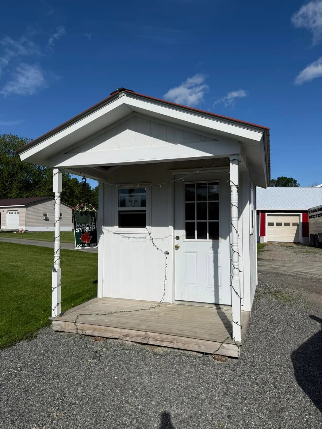 A small white farm stand building for Dairy Sweet Life in Vermont.